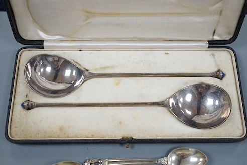 Four Georg Jensen sterling teaspoons, with Jensen box and a cased pair of continental white metal spoons, with cabochon terminals, gross 183 grams.